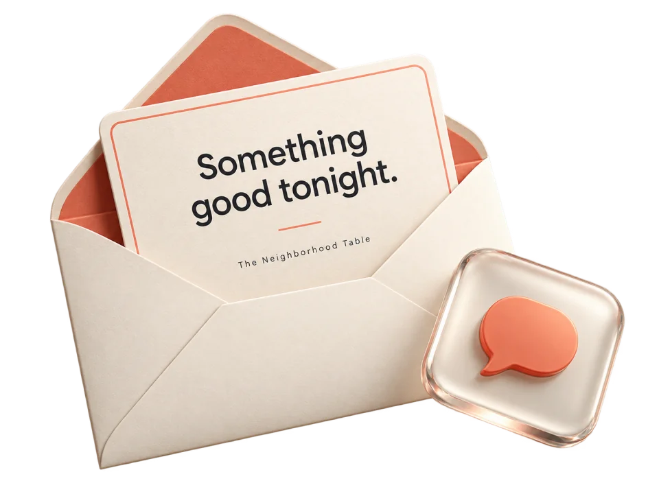 An ivory envelope and coral invitation paired with a glass message bubble.